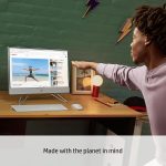 Person interacting with eco-friendly computer, watching yoga video in a cozy home office setting