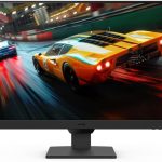 Monitor displaying a racing game with a yellow sports car speeding on a wet track