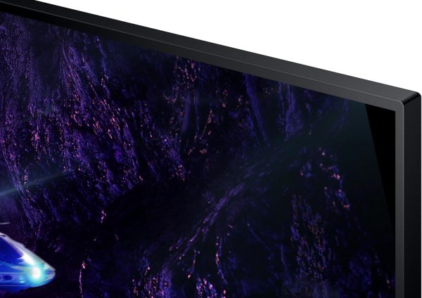 Close-up on a sleek, thin black monitor displaying vivid, abstract purple and blue graphics