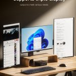 Triple monitor setup with sleek design on wooden desk, showcasing versatility and productivity boost