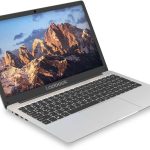 Modern silver laptop displaying a majestic mountain range on screen, ideal for work and leisure
