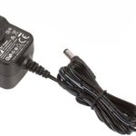 Black power adapter with UK plug attachment and long cable for electronic devices