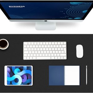 Modern desk setup with monitor, keyboard, mouse, tablet, notebook, pen, and coffee on a black mat